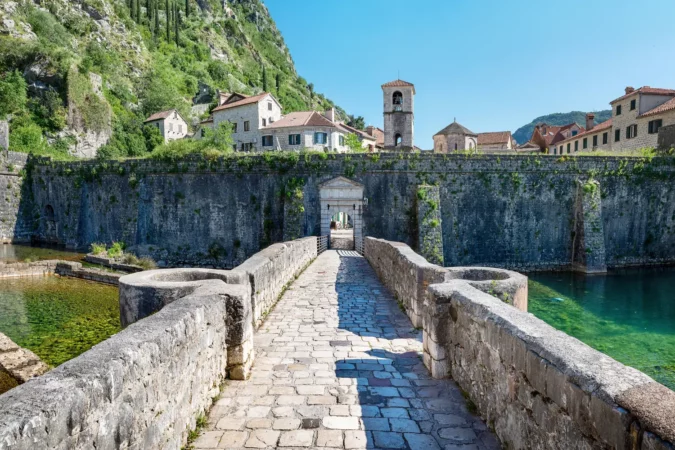Panoramic view of nord river gate, ancient fortress and church of St. Mary in Old Town of Kotor