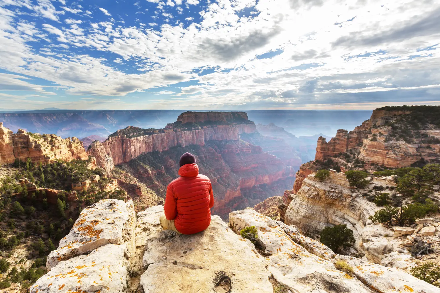 Hiker enjoying the view over Grand Canyon National Park in Arizona, USA