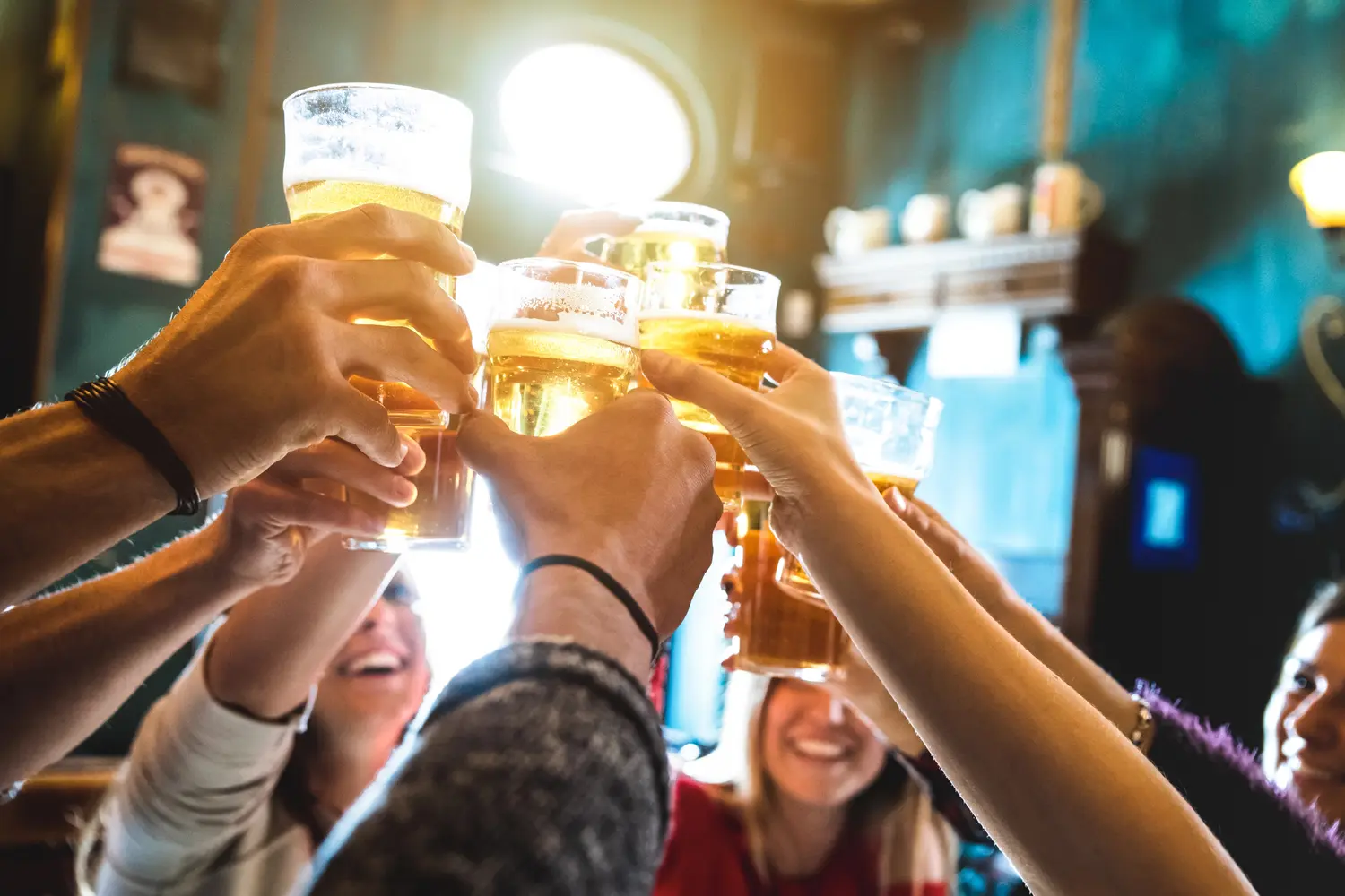 Group of people drinking beer at a pub