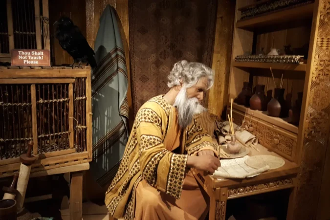 Noah writing at his desk at the Creation Museum in Kentucky