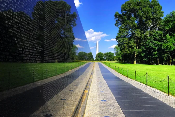 Vietnam War Memorial wall looking east at the Washington Monument