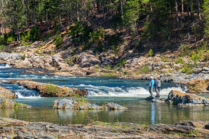 People fishing on Beaver River in Beavers Bend State Park in Oklahoma