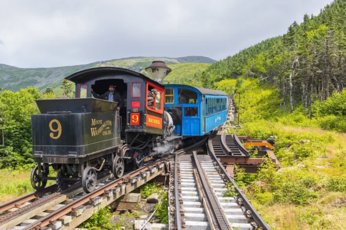 Waumbek steam locomotive passing a level junction on the Mt Washington Cog Railway track